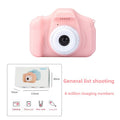 Çocuk Fotoğraf Makinesi - pembe mini dijital kamera önden görünüm ve kutu içeriği